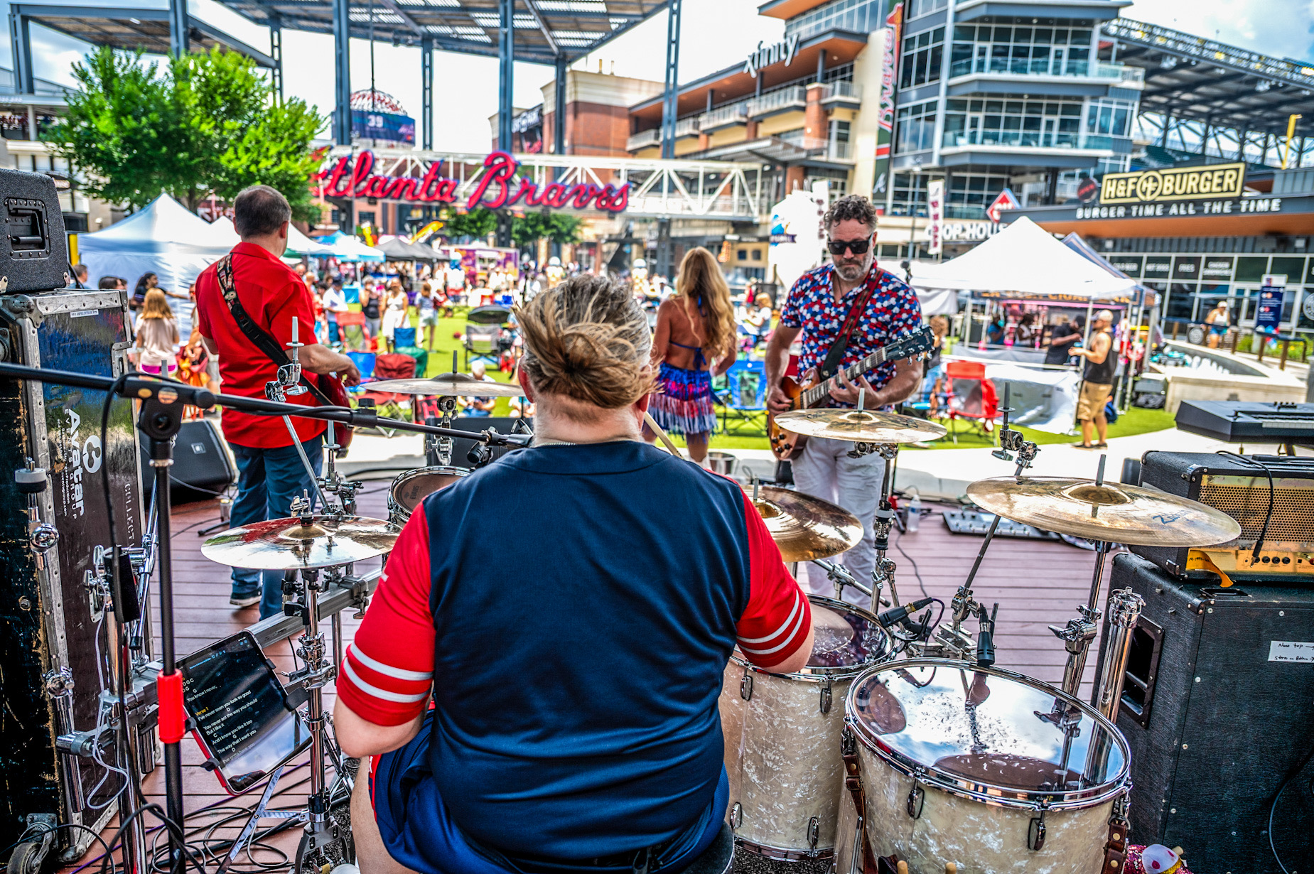 Band playing an outdoor festival crowd at The Battery Atlanta